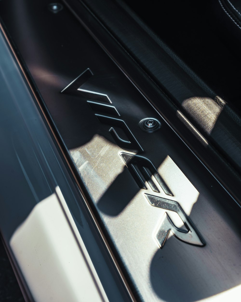 a close up of the door handle of a car