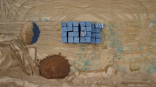 Aerial view of washed sand piles at a construction site