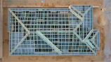Wide shot of a complex architectural framework under construction.