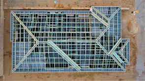 Wide shot of a complex architectural framework under construction.