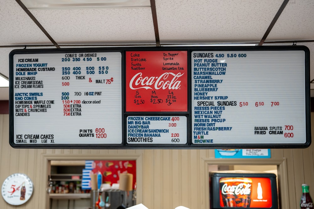 a menu for a fast food restaurant hanging from a ceiling