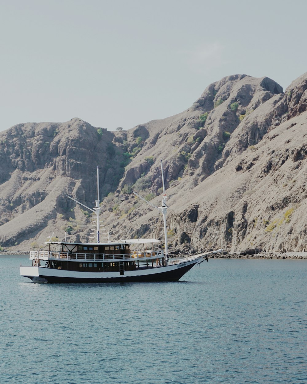 a large boat floating on top of a large body of water