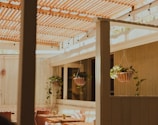 Outdoor seating area bathed in natural light with inviting table settings.