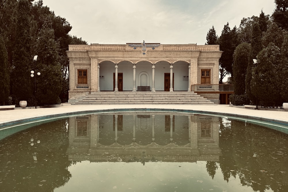 a building with a pool in front of it