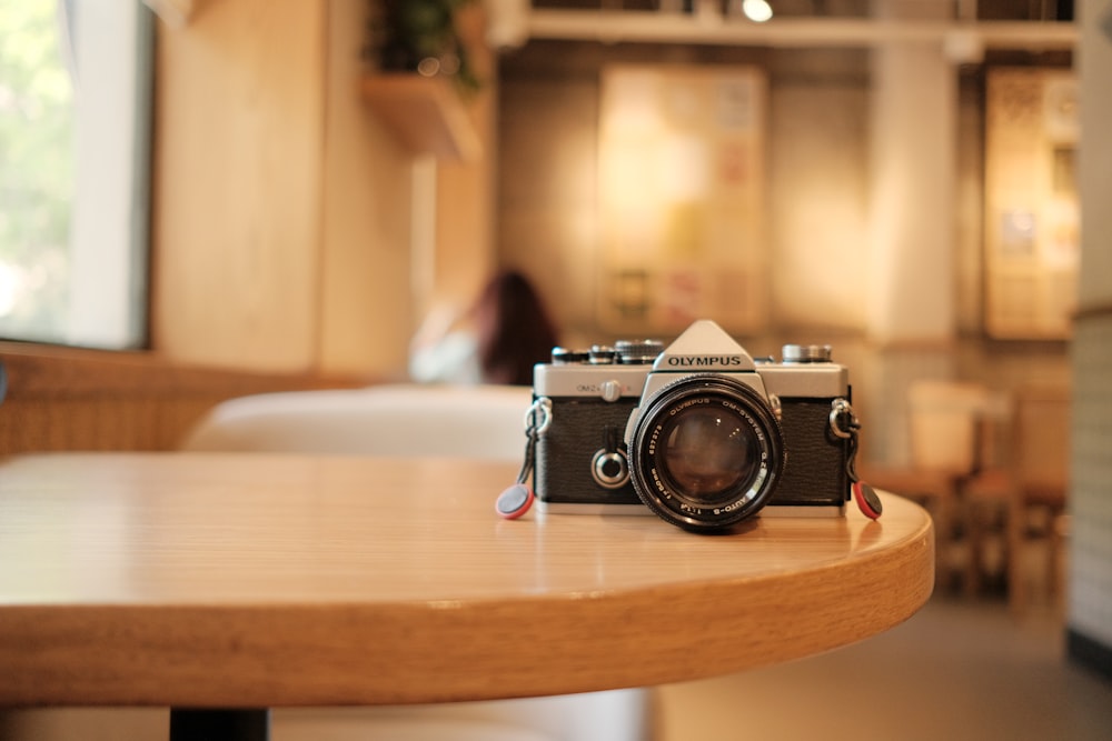 a camera sitting on top of a wooden table