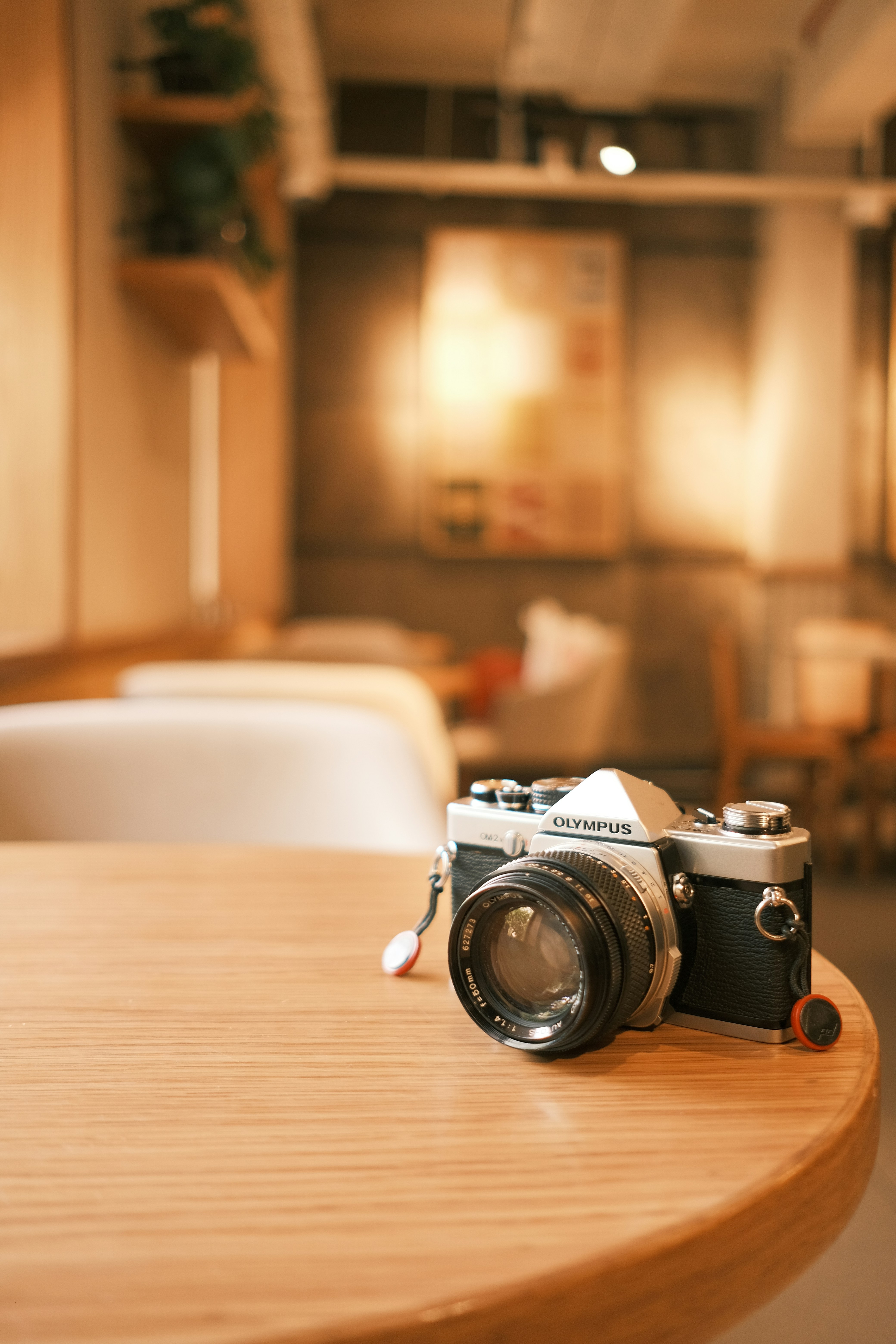 A camera sitting on top of a wooden table photo – Free Camera Image on ...