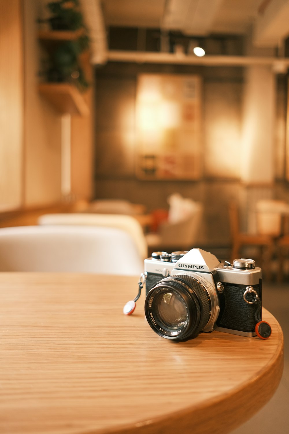 a camera sitting on top of a wooden table