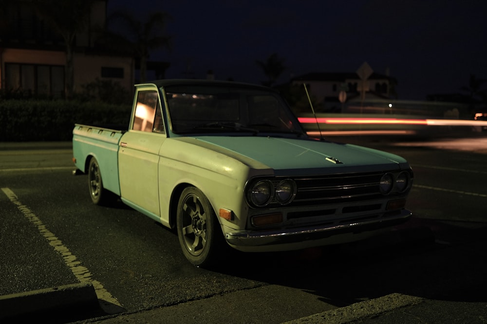 a truck parked in a parking lot at night