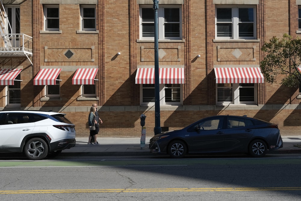 two cars parked on the side of the road