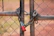 Close-up of a sturdy chain-link fence with a secure gate, showcasing quality craftsmanship.