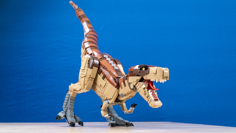 a toy dinosaur made out of legos on a table