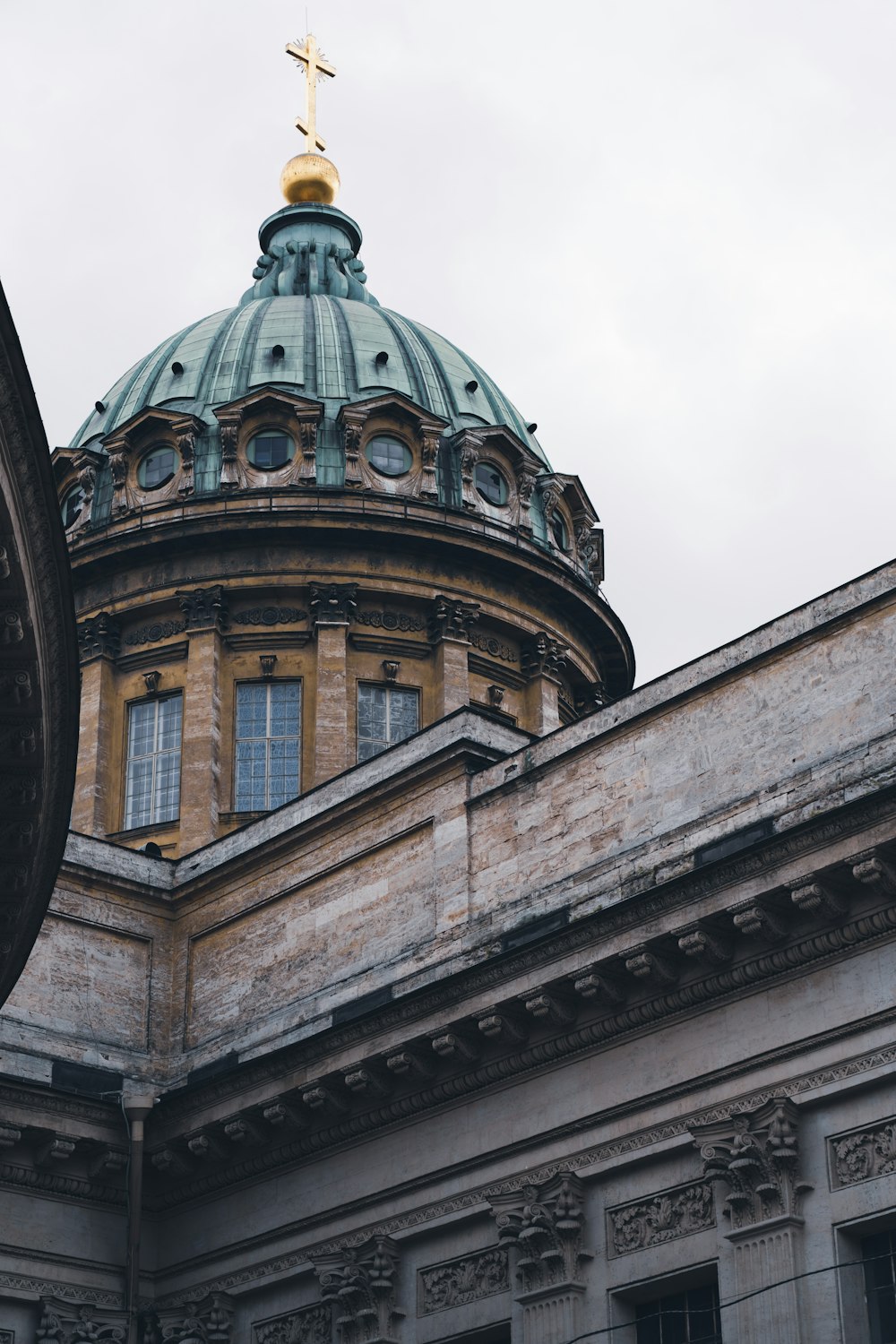 a large dome with a cross on top of it