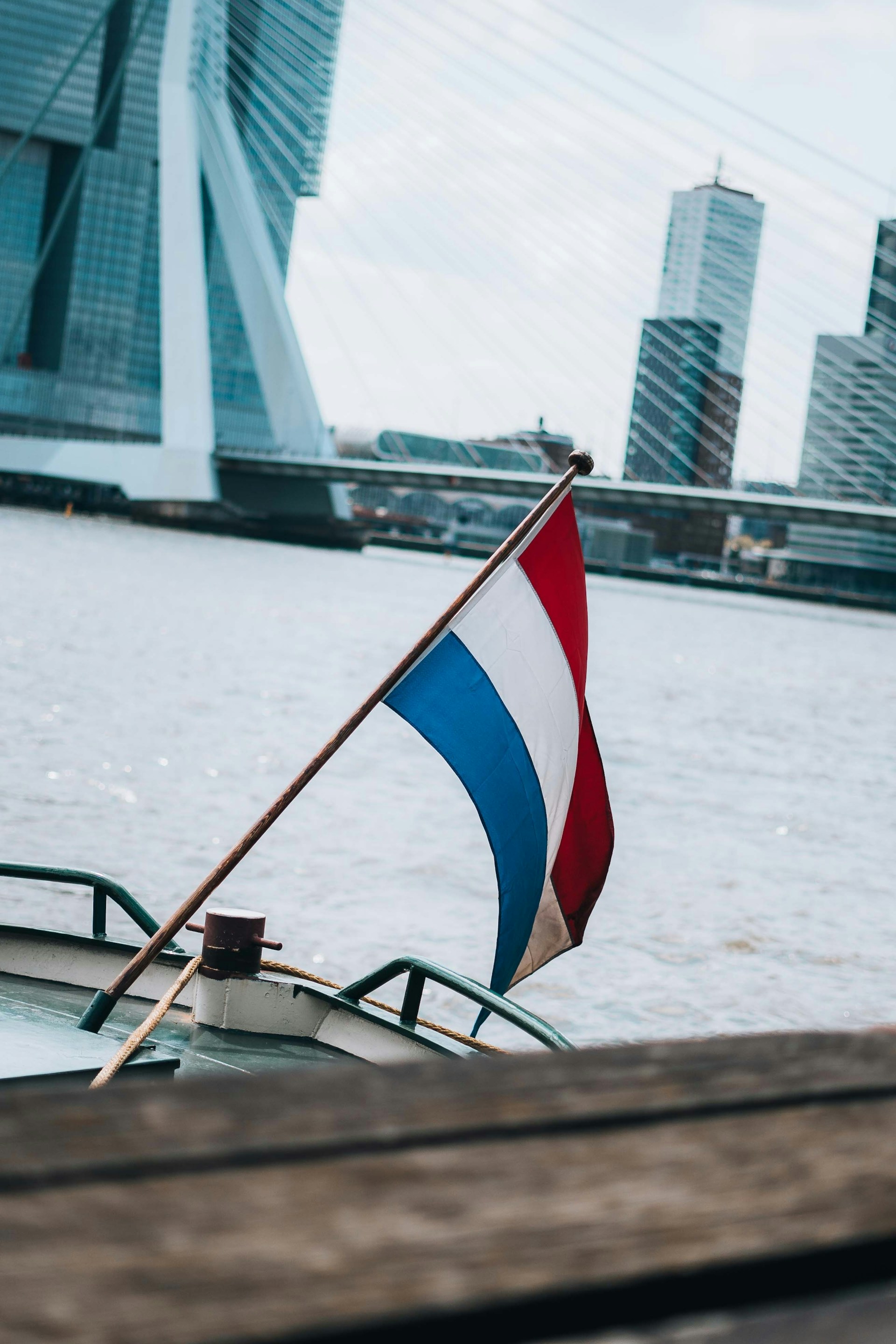 a boat in the water with a flag on it