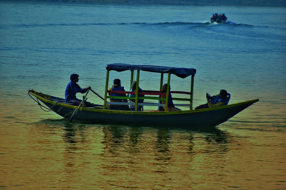 a group of people riding on the back of a boat