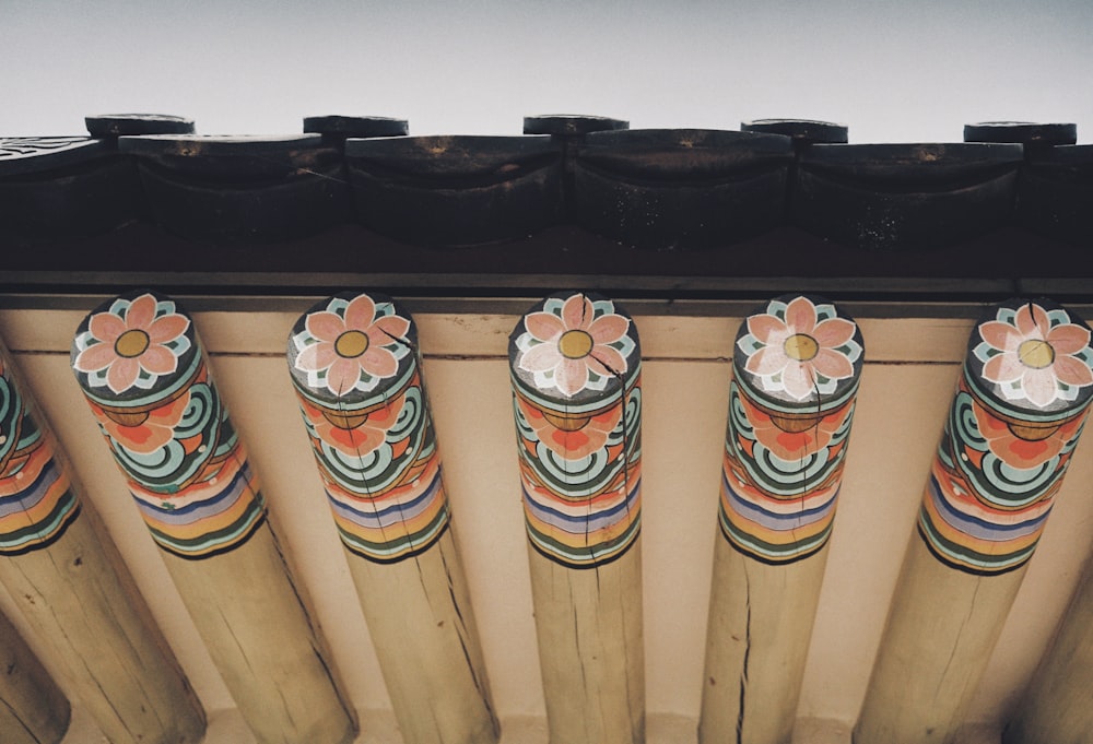 a close up of a row of decorative pillars