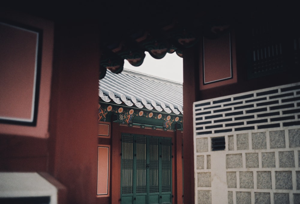 a building with a green door in front of it