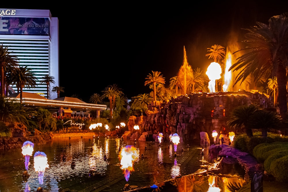 a night time scene of a fountain at the mirage hotel and casino