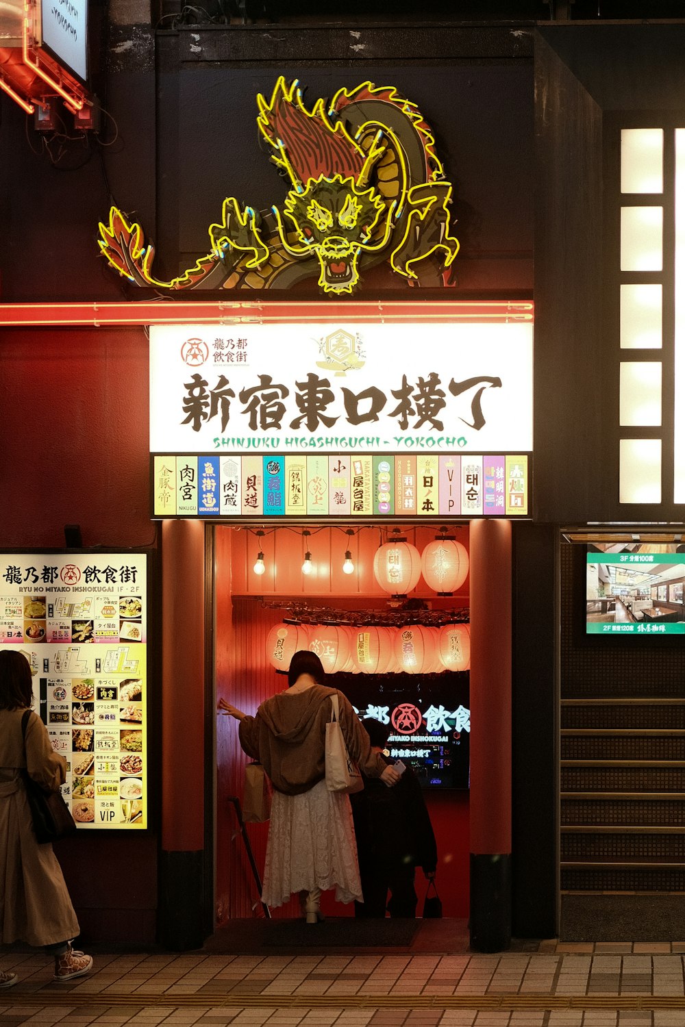 a woman standing in front of a chinese restaurant