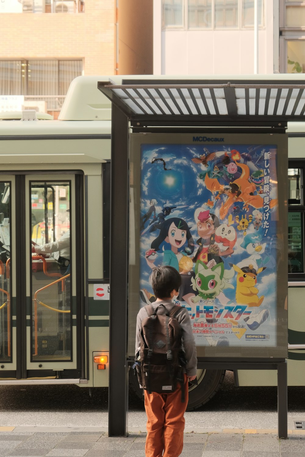 a person standing in front of a bus