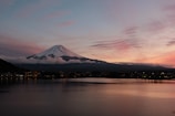 A picturesque landscape of Mount Fuji at sunset.