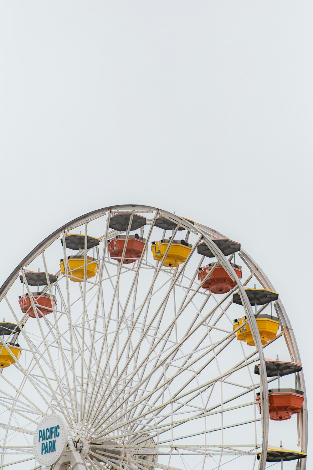 a ferris wheel with cars on top of it