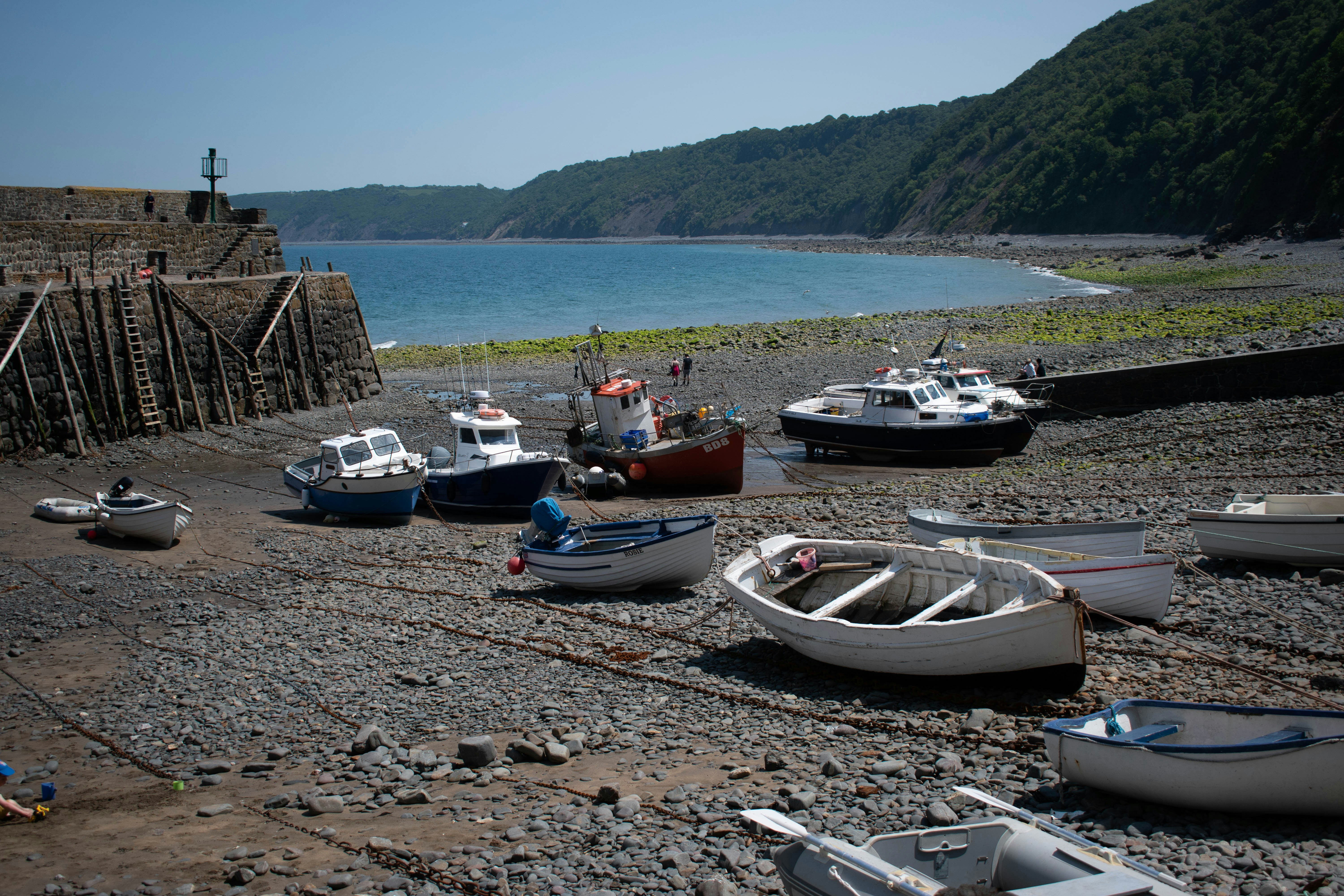 a group of small boats sitting on top of a beach
