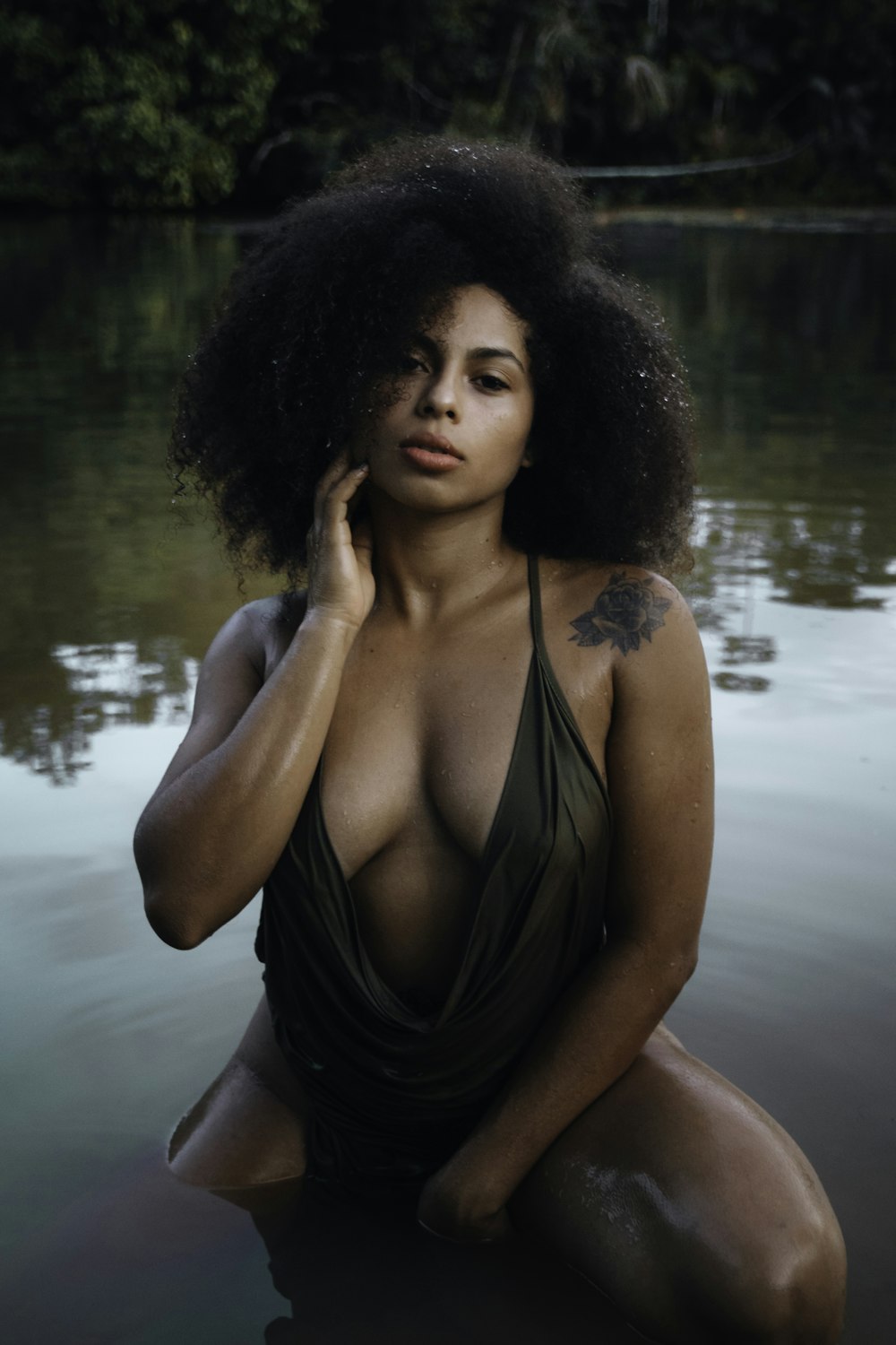 a woman in a bathing suit sitting in the water