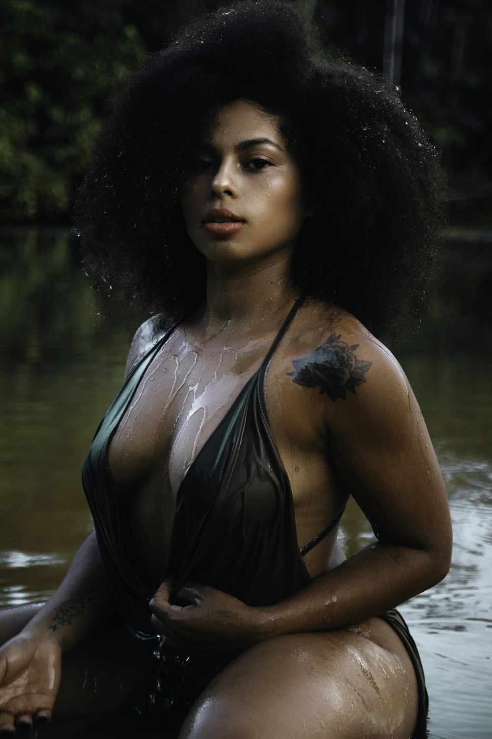 a woman in a bathing suit sitting in the water