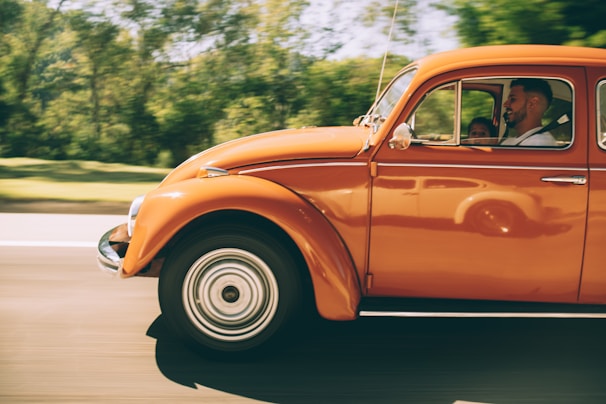 A family happily driving their new car, representing car loans.