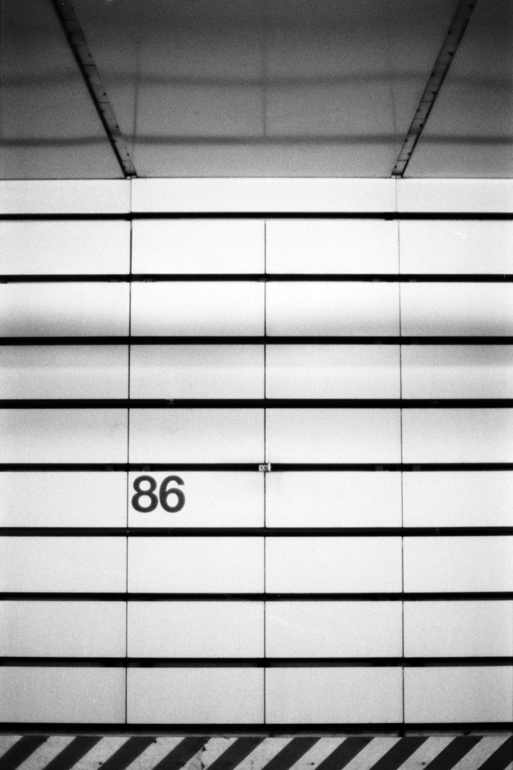 a black and white photo of a number on a wall