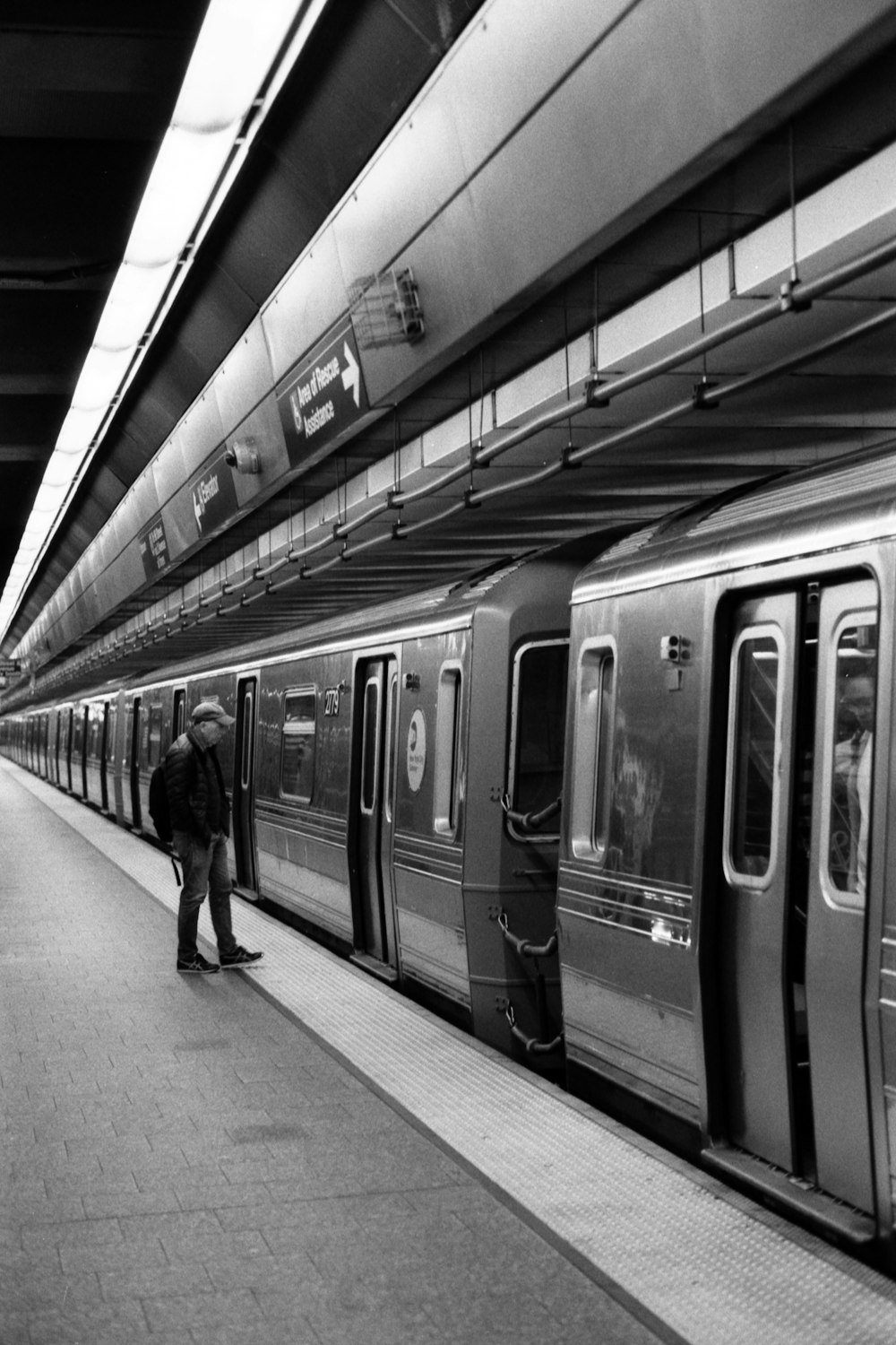 a black and white photo of a train at a train station