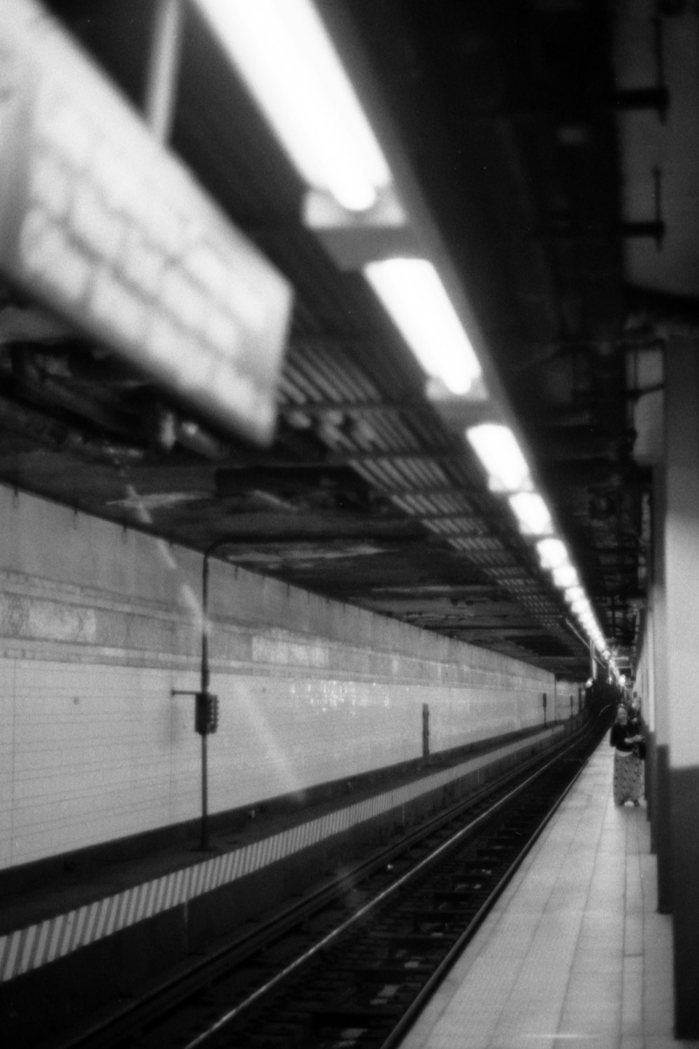 a black and white photo of a train station