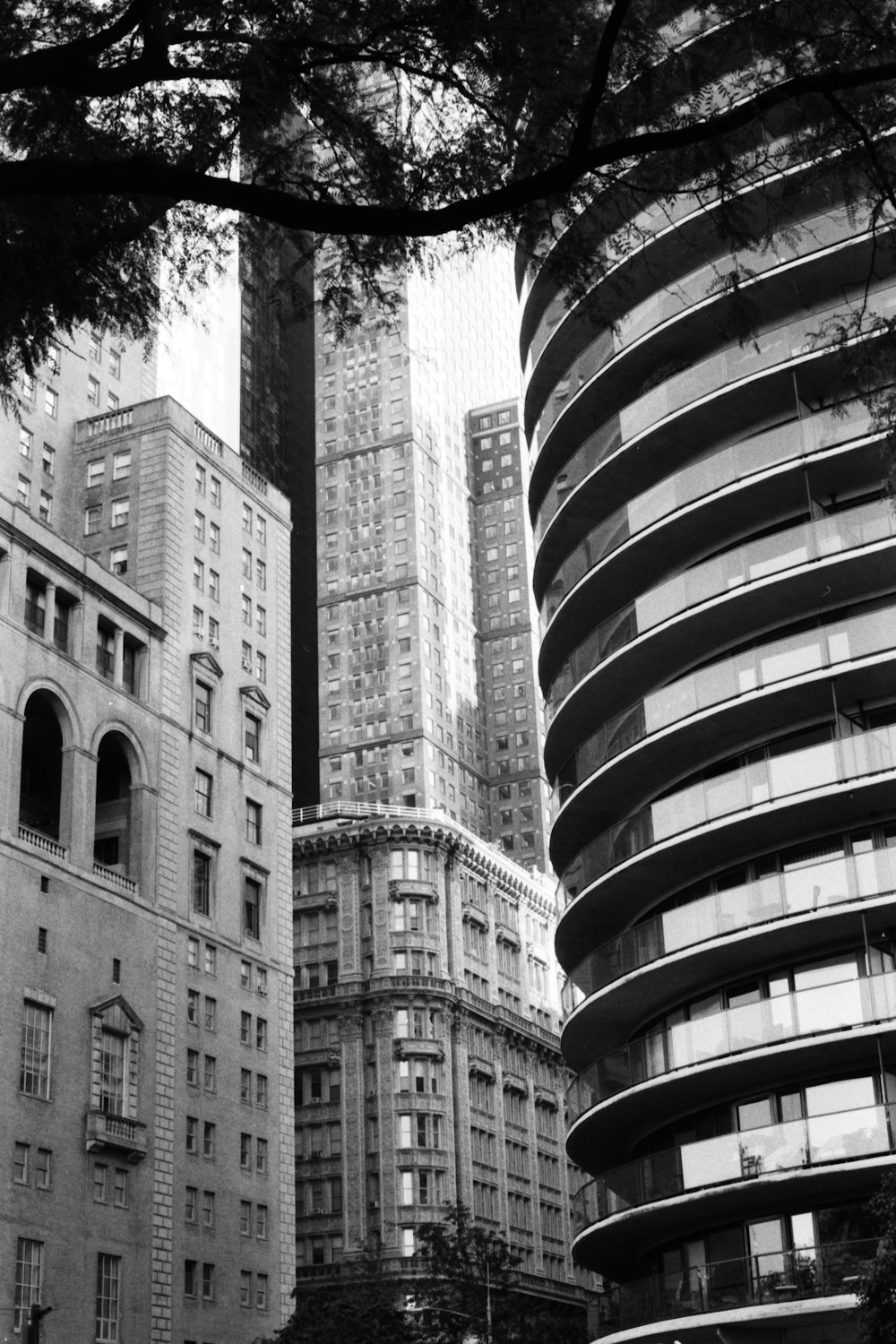 a black and white photo of tall buildings