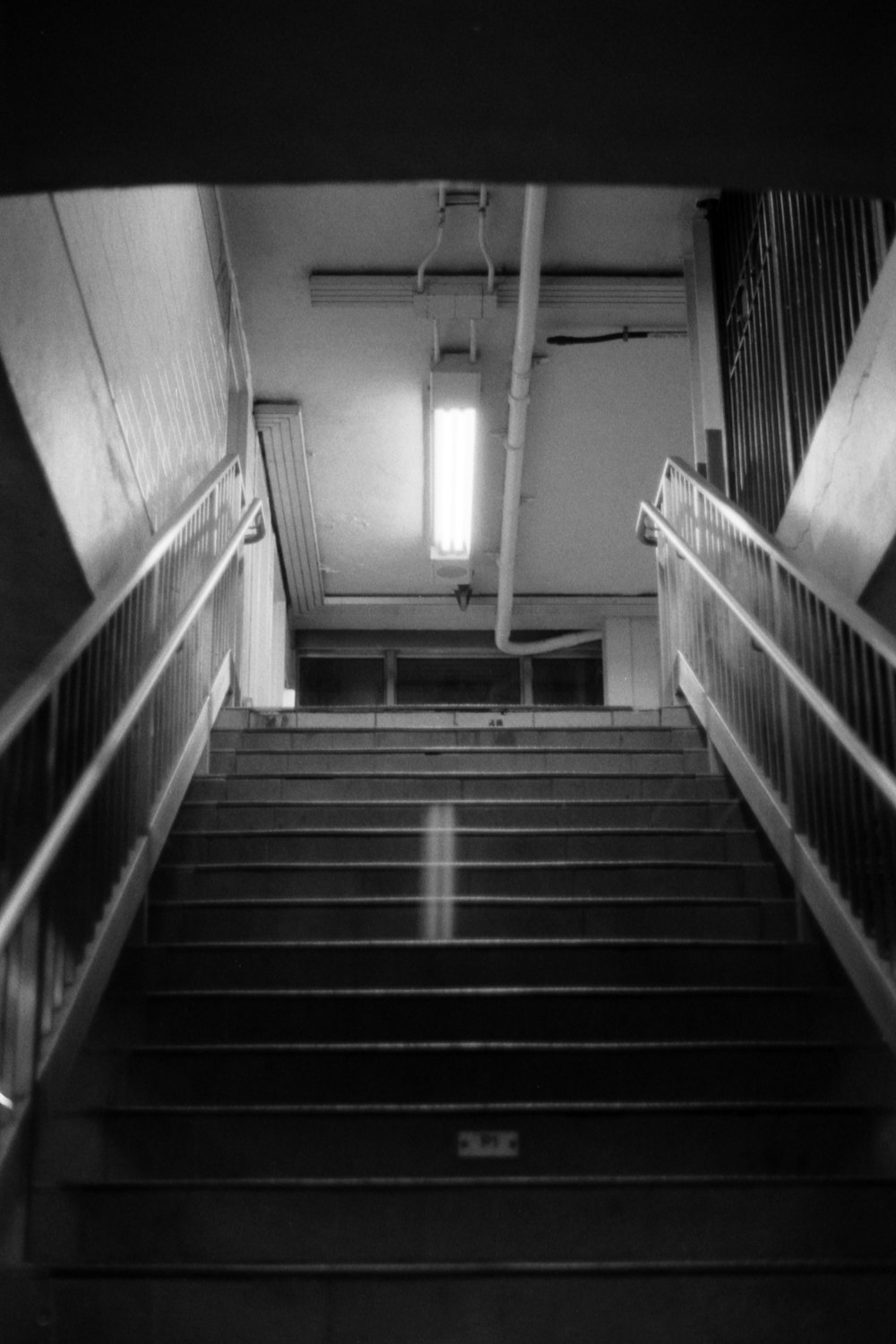 a black and white photo of a stairwell