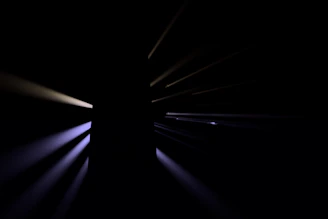 A sleek, dark cosmic background with golden geometric lines symbolizing energy flow and transformation.