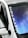 A close-up view of a car windshield featuring a reflective surface with a gradient of blue and purple tones. The car is white with a side mirror and a black roof. The words 'DACIA MAFIA' appear in bold white letters along the edge of the windshield.