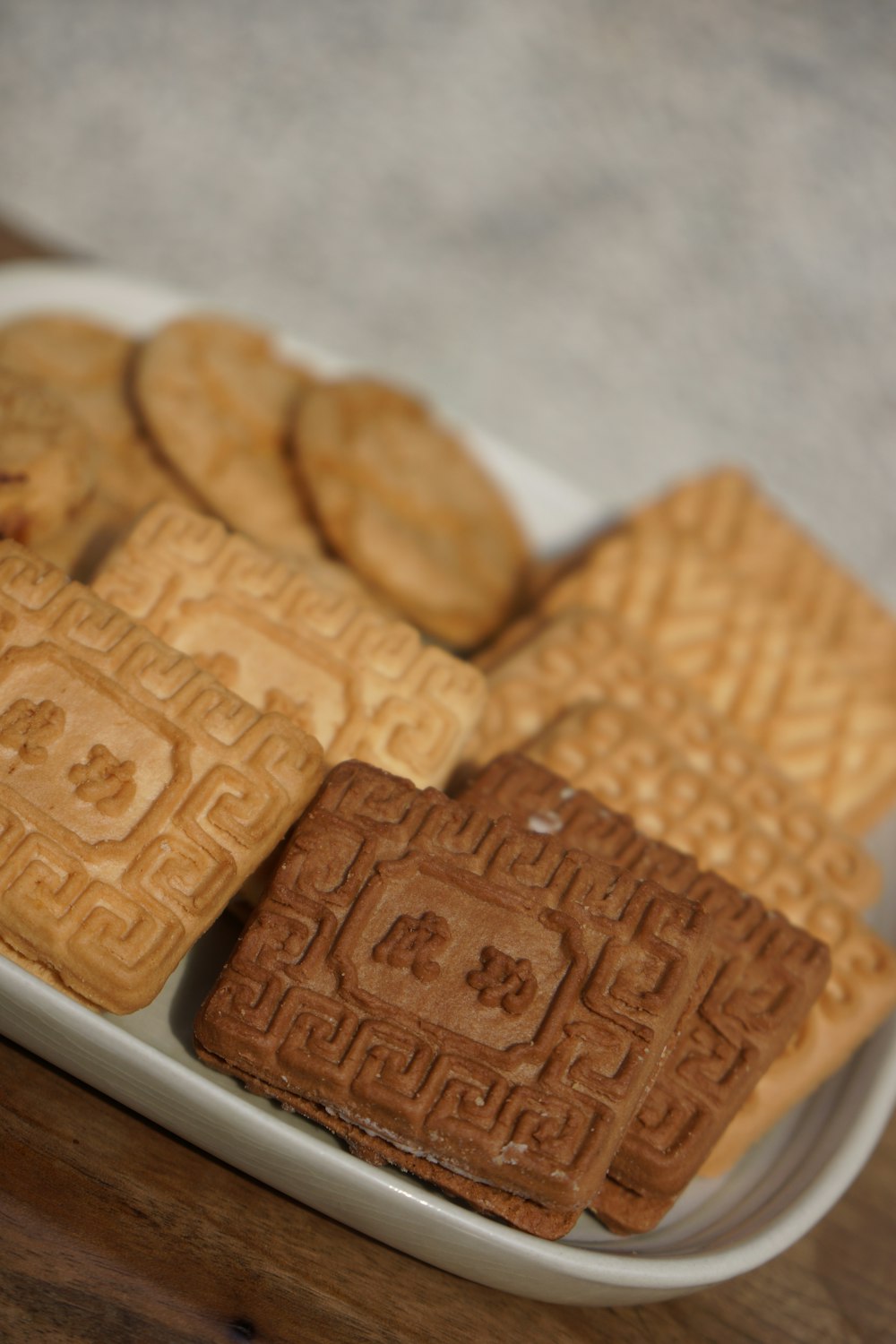 a white plate topped with cookies and waffles