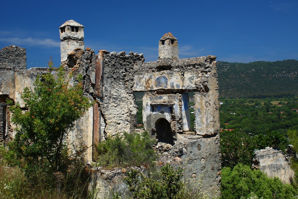 a very old building with some trees in front of it