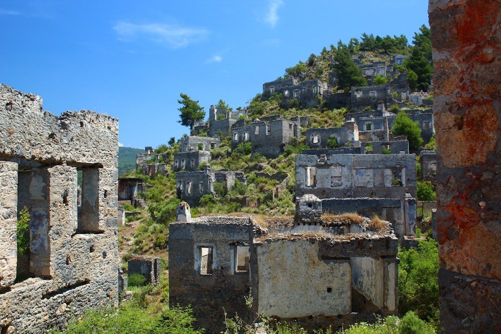 the ruins of a village on a hill