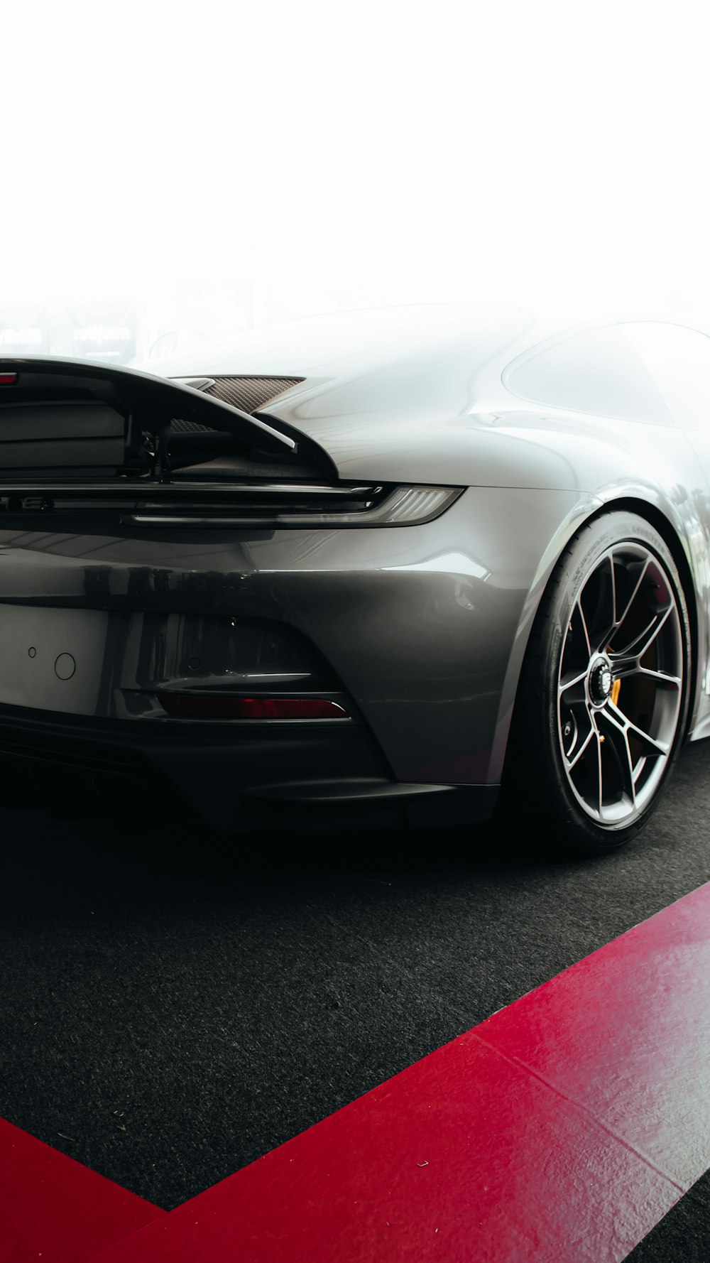 a grey sports car parked in a garage