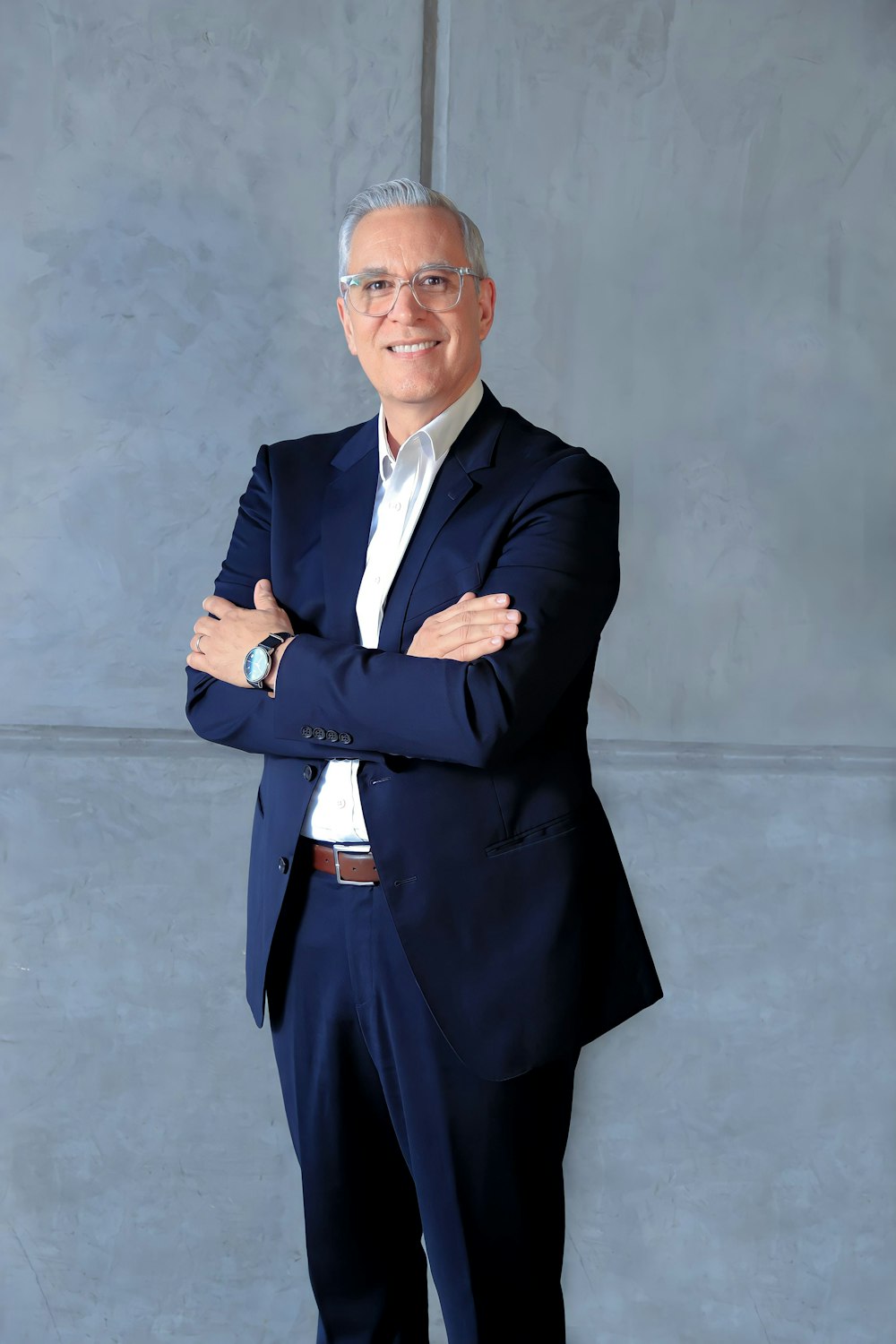 a man in a suit and tie posing for a picture