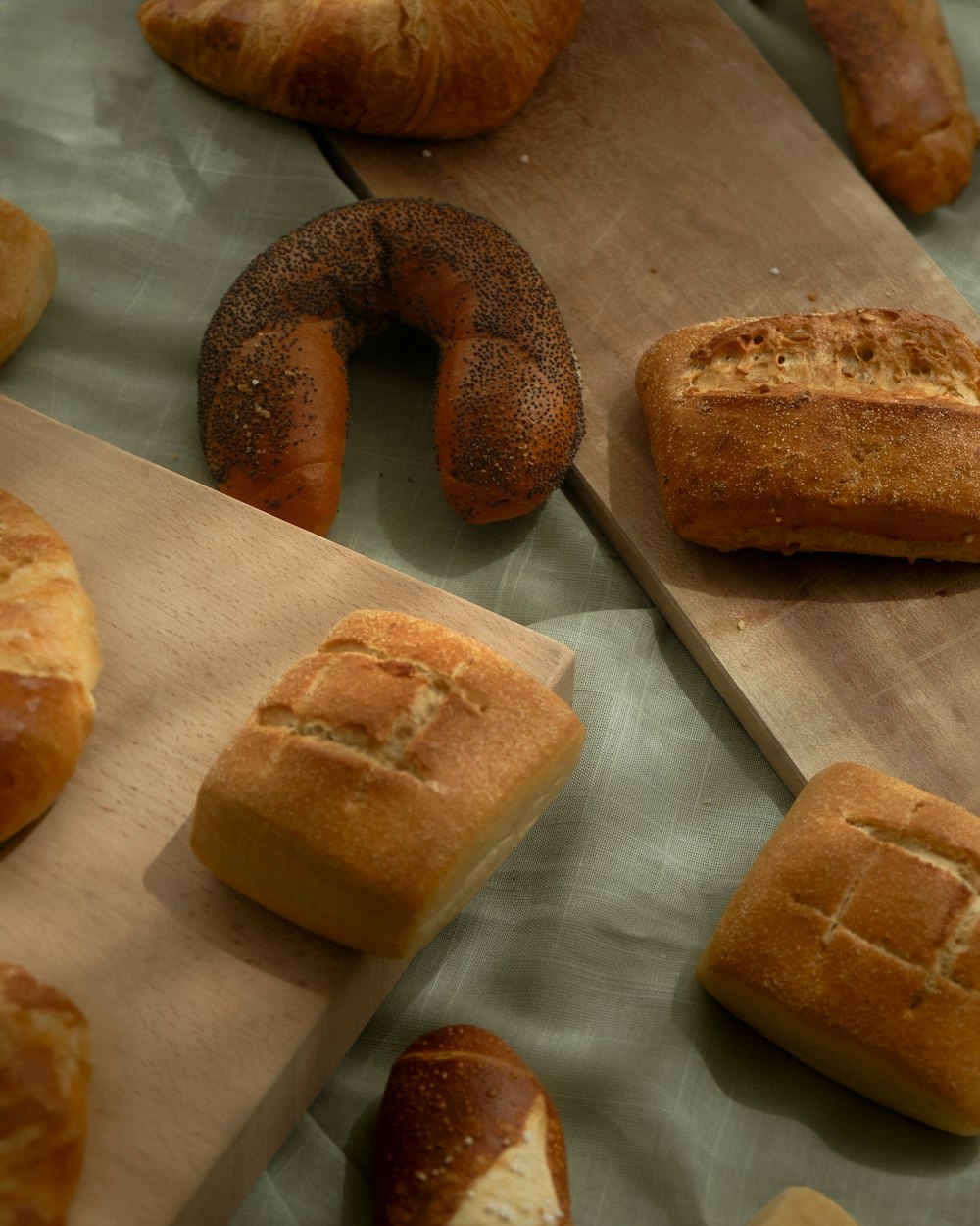 a table topped with lots of different types of bread