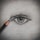A detailed pencil drawing of a human eye on paper. The eye is shaded intricately with visible eyelashes and a well-defined pupil. A sharpened pencil is positioned as if it is actively drawing the eye.