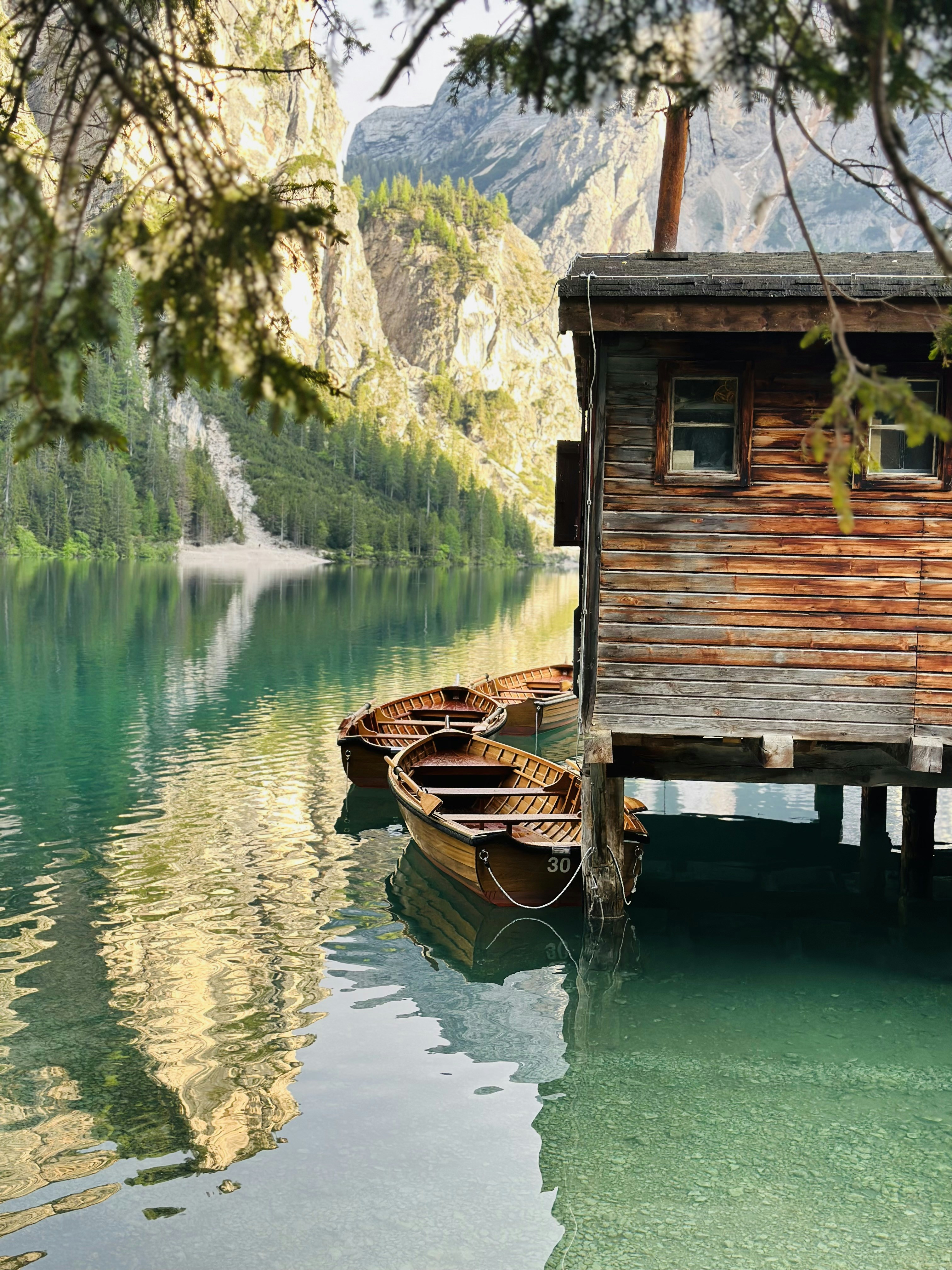 a boat is tied to a wooden dock