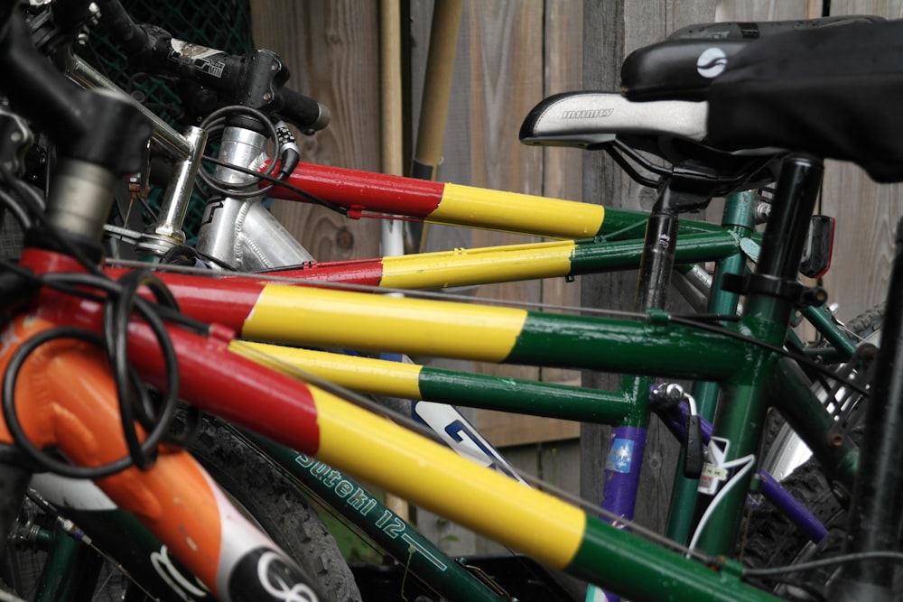 a close up of many different colored bicycles