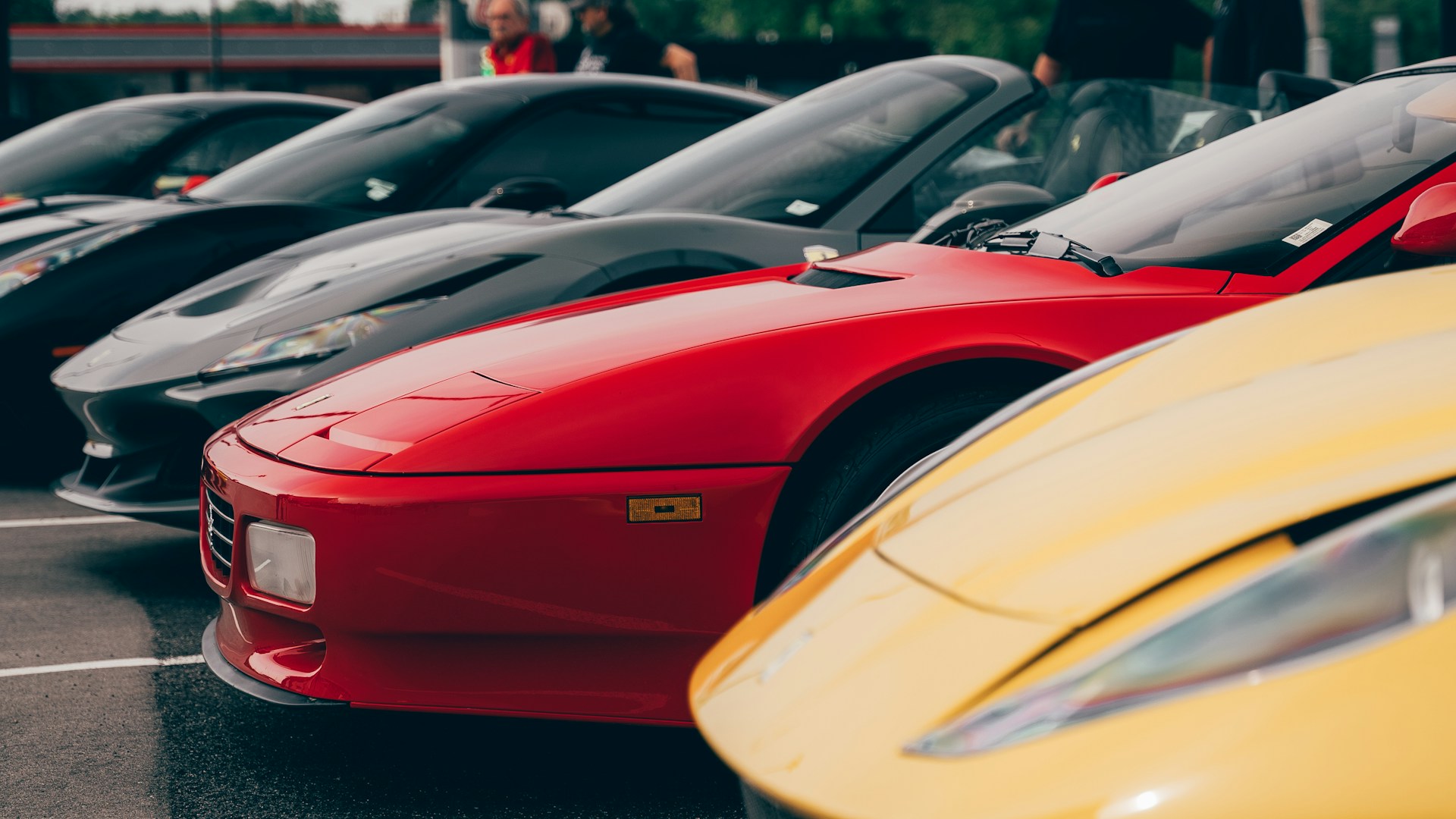 a row of parked cars in a parking lot