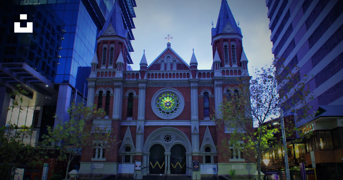 A large building with a clock on the front of it photo – Free Perth wa ...
