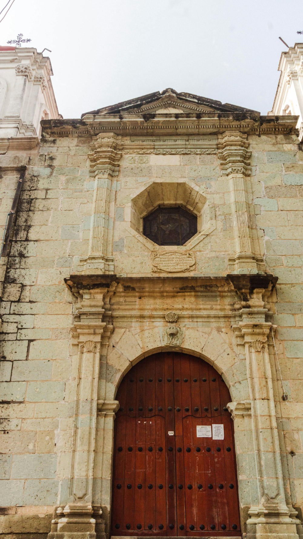 an old building with a large wooden door