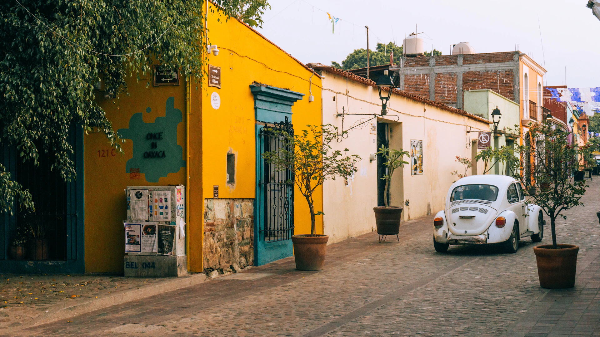 a white car parked on the side of a street