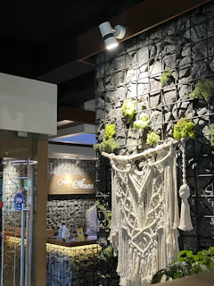 A welcoming office entrance with warm earthy tones and a clear sign displaying 'kashivastra'.